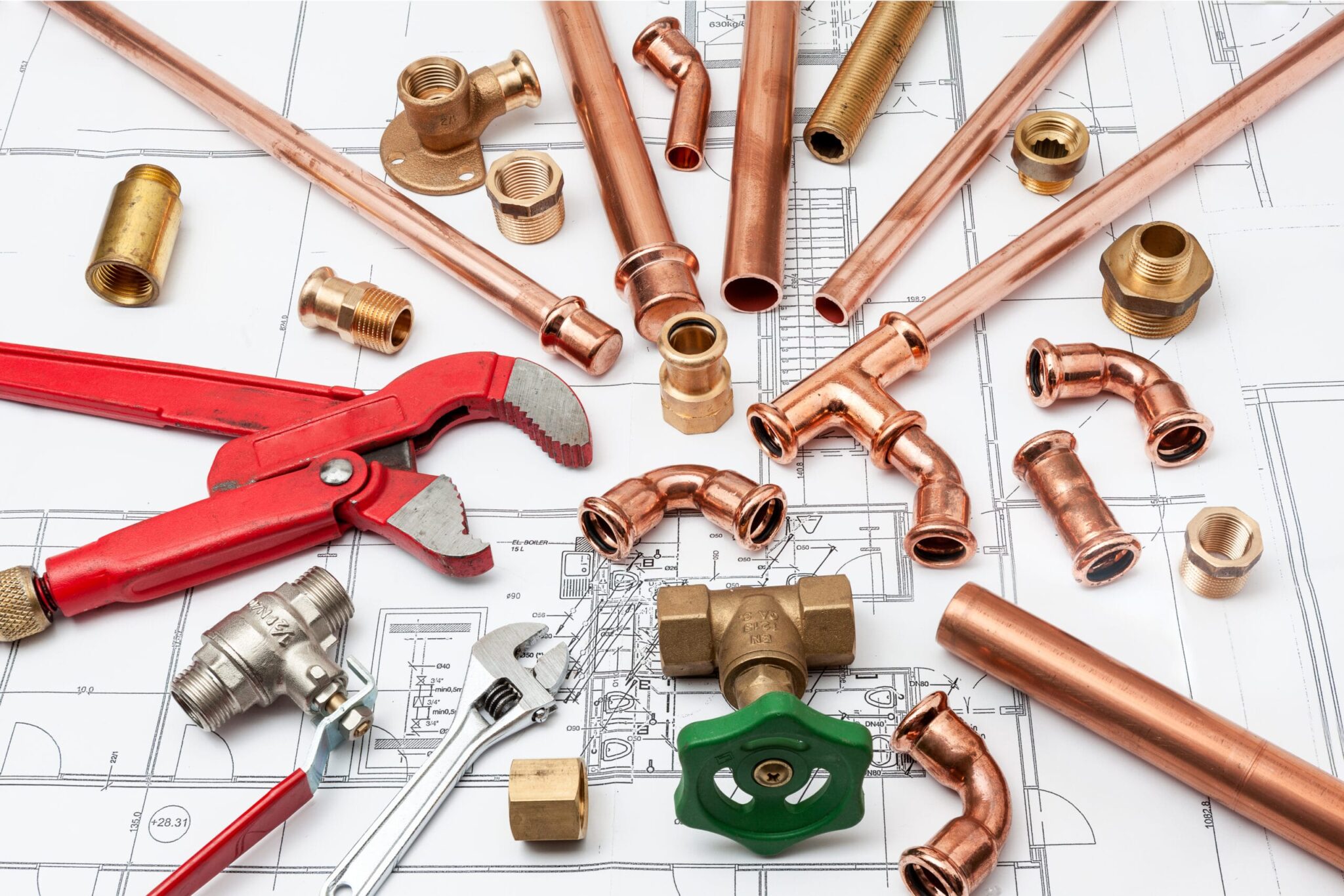 Copper pipes, fittings, valves, and plumbing tools in Loveland
