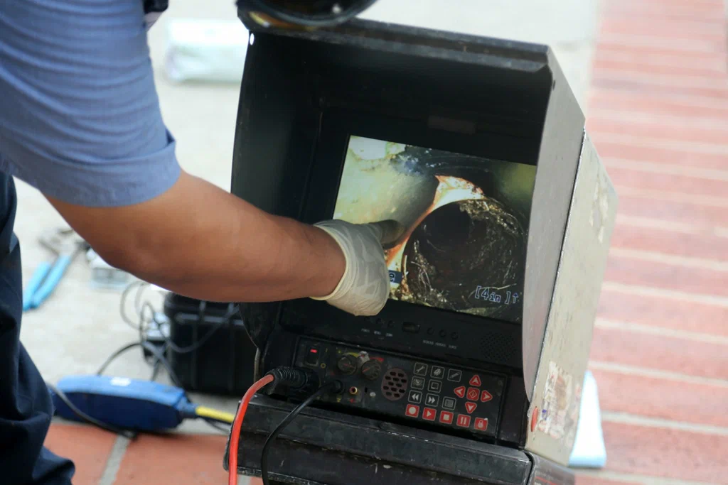 Technician viewing a drain inspection camera in Loveland